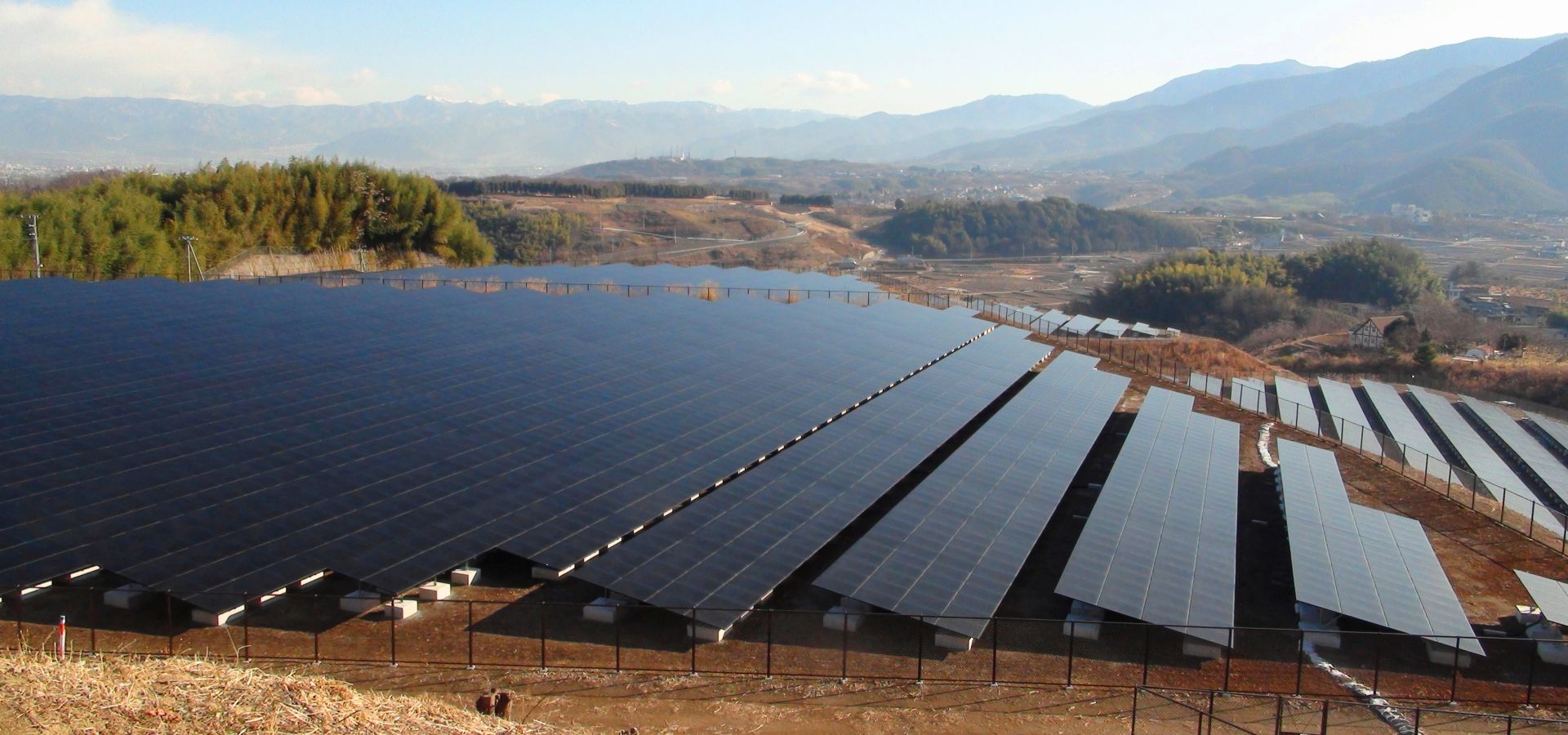 A huge solar farm in front of a dry landscape in Japan. 
